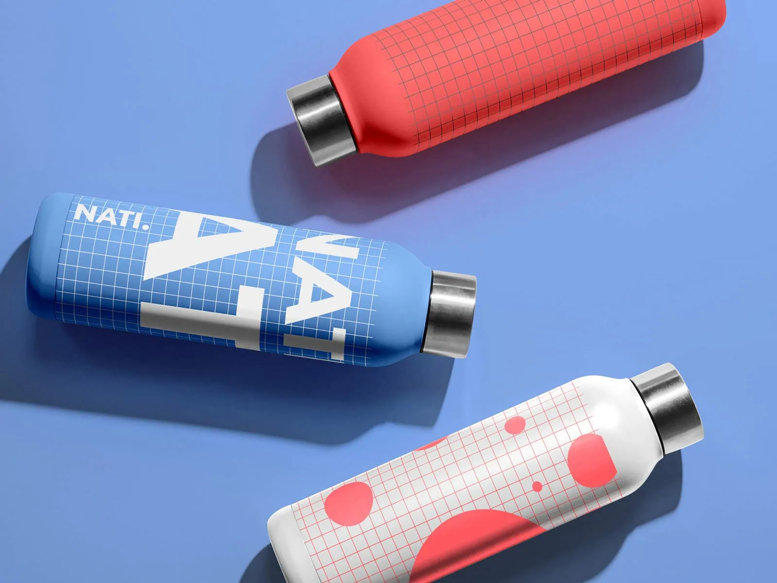 Free steel water bottle mockup — three bottles on solid background