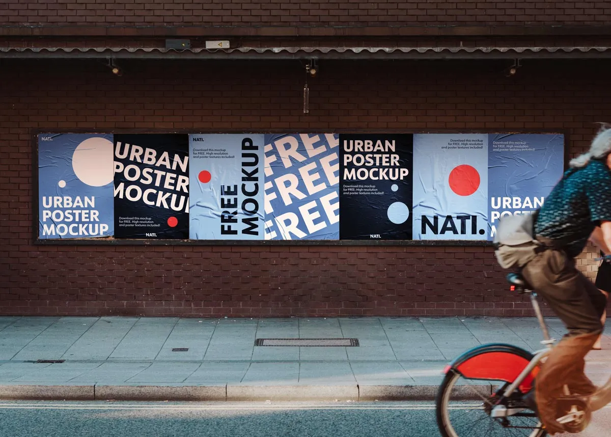 Free urban city poster wall mockup with 7 posters on brick wall