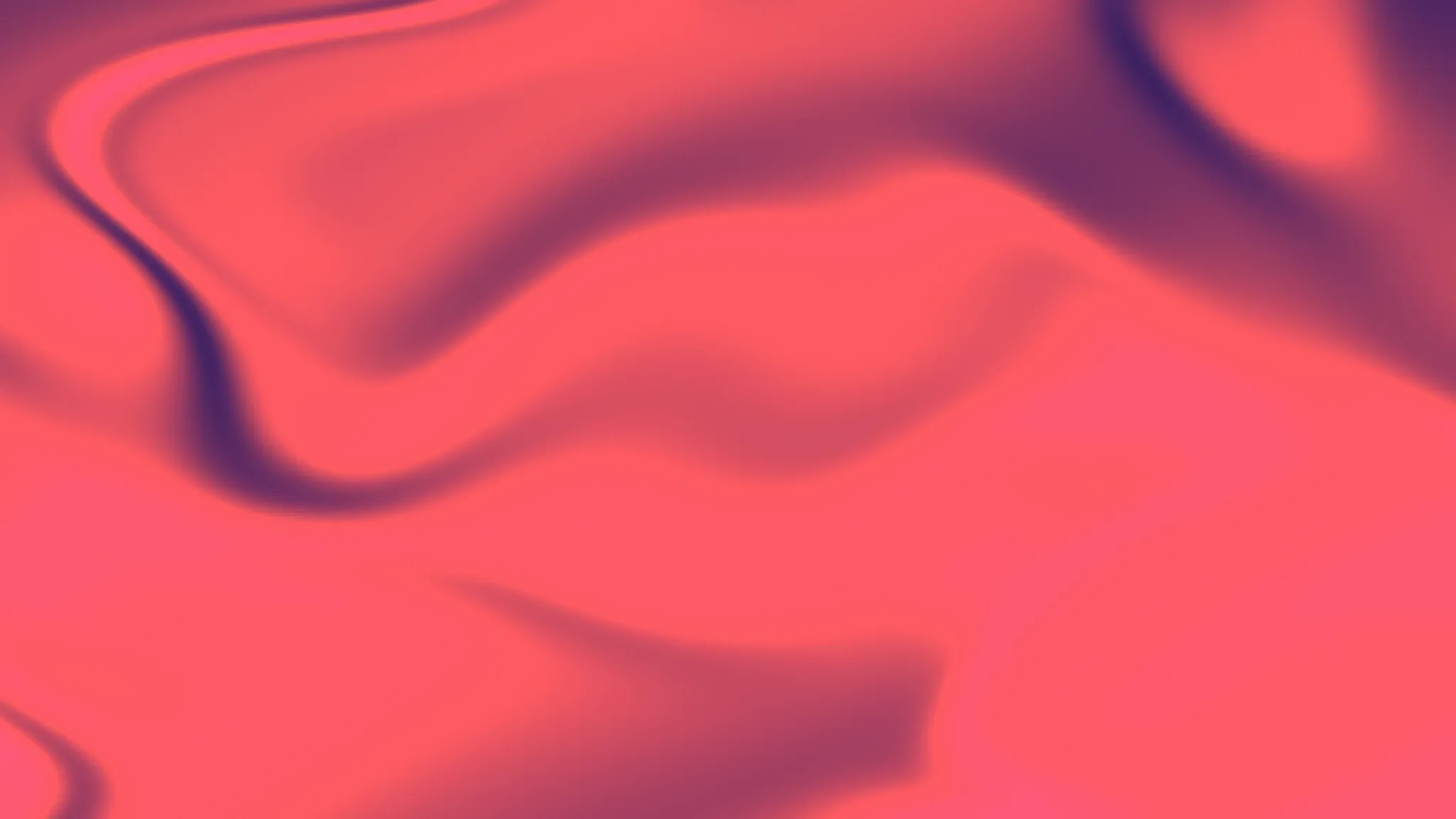 Abstract gradient background with red and pink hues, evoking a sense of energy and creativity.
